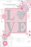This anniversary card captures the feeling of enduring romance in a palette of soft blush pinks, pearly whites, and graceful silver that would suit a quiet evening together in Keston perfectly. At the centre, the word LOVE is beautifully presented in raised, glittering letters, with the letter O transformed into a shimmering heart shape, its textured silver surface catching and reflecting the light like a polished charm. Surrounding this focal motif, delicate blossoms in shades of blush, mauve, and pale grey unfurl with a watercolor softness, their petals outlined in fine, flowing lines that curve like the stems of a hand-tied bouquet. Gentle swirls, tiny petals, and subtle butterfly-like shapes dance across the card, adding a sense of movement and playful intimacy without overwhelming the design. The blush-pink background is soft and soothing, offering a romantic contrast to the silvery details and enhancing the dreamy ambiance. Graceful script messages-phrases such as On Our Anniversary and I love you today and always-are threaded through the design, their elegant lettering echoing the personal touch of a handwritten note that might accompany fresh flowers delivered across Keston by a caring local florist. The overall impression is tender and reflective, like a shared memory revisited on a leisurely walk through nearby parks. With its tactile glitter, refined florals, and heartfelt text, this card feels like a keepsake meant to be treasured long after the anniversary day has passed.
